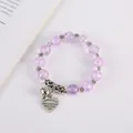 Bracciale bohémien con perline viola crepate e ciondolo a cuore e campanello in argento - Viola
