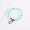 Bohemian blue crackle crystal beaded bracelet with heart pendant and small bell - Lake Blue