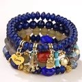 Bracciale multistrato con perle blu, ciondoli Tour Eiffel, gufo e cuore dorato - Blu