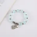 Bohemian light blue crackle crystal beaded bracelet with vintage silver charms - Light Blue