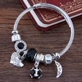 Silver beaded bracelet with crystal heart and black stones on a vintage wooden background - Black