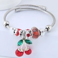 Silver twisted open bangle with red enamel cherry charm and sparkling crystal beads - Red