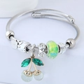Silver stainless steel cherry charm bracelet with crystal beads and braided wire band - Green