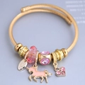 Golden stainless steel charm bracelet with pink crystal beads and unicorn heart pendant - Pink