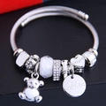 Silver beaded bracelet with crystal heart and bear charms on woven steel band - White