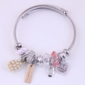 Silver steel wire bracelet with crystal heart pendant and pearl charms for women - Pink
