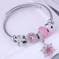 Bohemian silver twisted steel bracelet with pink crystals, snowflakes, and charms - Pink