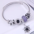 Bohemian beaded charm bracelet with lilac cat eye stone and snowflake tassel pendant - Black
