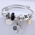 Silver beaded wire bracelet with crystal dolphin pendant and handmade charm charms - Black