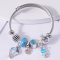 Perlenarmband mit blauem Katzenaugen-Hasen, Heißluftballon und Kronen-Anhängern - Blau