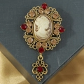 Spilla cammeo vintage con cristalli e cornice floreale in rilievo placcata oro - Champagne