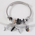 Bracciale in acciaio inossidabile a treccia con ciondoli a forma di pesce, stella e perla - Nero