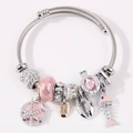 Bracciale a perline argento con ciondoli a lisca, stella marina e conchiglia su bianco - Rosa