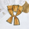 Detail view of yellow silk scarf with green borders and rose logo on white fabric - Dark Green Edge Ginger Letter Style (17)