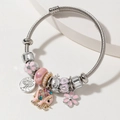 Silver steel cable bracelet with tree of life charm, pink enamel elephant and crown beads - Pink