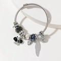 Silver steel cable bangle with butterfly charm, white pearls and blue crystal beads - Black