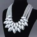 Industrial style multi-layer matte silver leaf necklace on a black velvet display stand - Silver