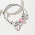 Bracciale a cavo d'argento con ciondoli a cuore rosa e carrozza su base bianca - Rosa