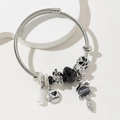Silver beaded bracelet with fox pendant, castle charm and black gemstone elements - Gray