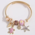 Bracelet bohème doré à cordon torsadé avec breloques tortue, étoile de mer et perles - Violet