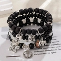 Bohemian multi-layer beaded bracelet set with silver butterfly, elephant and anchor charms - Black