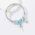 Bracciale ritorto argento con serratura a cuore blu, chiave malocchio e ciondolo cane - Blu