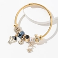 Gold beaded charm bracelet featuring hot air balloon, cute bunny, and crown pendants - Black