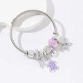 Adjustable silver wire ocean charm bracelet with starfish, turtle and sea shell charms - Purple