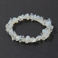 Close-up of bohemian irregular opal stone bracelet on a textured dark grey surface - Translucent White Opal Style (12)
