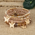 Böhmisches mehrlagiges Perlenarmband-Set mit rosa Kristallen und goldenen Schmetterlingen - Kaffeebraun