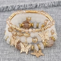 Détail de l'ensemble de 4 bracelets bohèmes multicouches perlés avec breloques papillon - Blanc