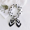 Silk-textured square scarf with black polka dots and stripe pattern tied in a bow - Black Polka Dot Frame
