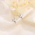 Minimalist silver four-pointed star stud earrings on elegant textured fabric - Silver (214 Silver)