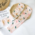 Pink ice silk sun protection sleeves featuring peach prints and peach lettering design - Peach