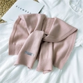 Pink knitted scarf shawl with ribbed edges and elegant knot detail shown in flat lay - 42x95cm / Pink