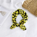 Elegant silk scarf in black and yellow daisy print tied into a decorative bow - 50cm x 50cm / Yellow and Black Rose