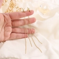 Elegantes pendientes largos de borla en forma de X dorada con circonitas brillantes - Dorado