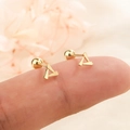 Gold hollow geometric triangle stud earrings with screw ball back shown on ear - Hollow Triangle Style (C158) / Gold