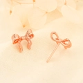 Elegant rose gold bow stud earrings with fabric texture on a soft minimalist background - Rose Gold (258)