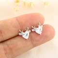 Exquisite silver heart-shaped reindeer antler stud earrings held to show scale - White Gold (C174)