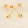 Chic golden balloon dog stud earrings with a polished metallic finish on white linen - Gold (259 Gold)
