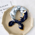 Blue and yellow square silk scarf with shell print in an octagonal display tray - Blue Scallop Floral