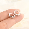 S925 sterling silver bow earrings with sparkling star zirconia charms held by hand - Star Decor Ear Buckle / White Gold (HL-83)