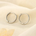 Detailed close-up of polished S925 sterling silver hoop earrings on soft fabric - Single Piece / 12mm / Silver