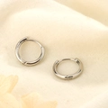 Detailed close-up showing the S925 sterling silver hallmark on minimalist hoop earrings - Single Piece / 10mm / Silver