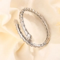 Luxurious snake-shaped open bracelet with sparkling pavé zircons in a flexible scale design - White Gold