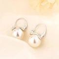 Detail of elegant pearl drop earrings with silver hooks on textured linen background - Pearl Ear Buckle Style (HL-97)