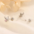 S925 silver butterfly stud earrings with pink zircon on a soft fabric background - White Gold