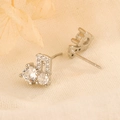 S925 silver music note stud earrings featuring sparkling cubic zirconia for women - White Gold