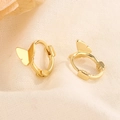 Minimalist gold butterfly huggie hoop earrings displayed on textured beige linen - Gold Color (HL-107)